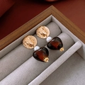 Golden vintage heart earrings with portrait relief and brown glass pendant on grey velvet - Gold Portrait Heart