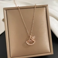Rose gold clover pendant necklace in fan shape with zircon inlay on white silk - Dancing Fan-Shaped Zirconia Style (8959) / Rose Gold
