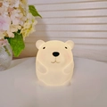 Adorable white bear shaped night light with warm yellow glow made of soft vinyl material - Hamster