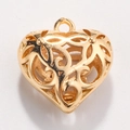 Macro view of gold heart pendant with intricate floral filigree cutout and hanging loop - Style 12-Patterned Heart