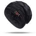 Detail of gray knitted hat with thick fleece lining and leather fashion patch - Hat / Black
