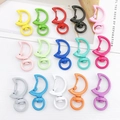 Macro shot of 15 colorful moon-shaped alloy lobster clasps with rotating rings - Mixed Moon/Crescent Clasps Set (10Pcs)