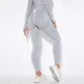 Close-up of seamless acid wash yoga leggings showing breathable mesh and peach lift texture - Washed Light Grey
