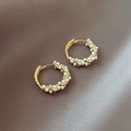 Elegant gold hoop earrings with small pearls on brown silk fabric background - Winding Pearl Hoop Earrings - E5170 Gold