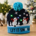 Close-up of LED knitted Christmas hat with snowman pattern and glowing festive lights - Blue Double Snowman