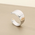 Macro detail of high-polish silver stainless steel wide open ring with mirror finish - US 6