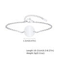 Macro view of polished stainless steel round tag bracelet showing size and S.STEEL stamp - Steel