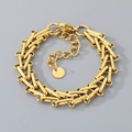 Detail of gold woven horseshoe chain bracelet with S.STEEL material engraving mark - Gold (KB204369-ZCG)