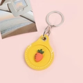 Yellow leather AirTag case featuring a cute 3D carrot design and silver keychain ring - Snap Button Style - Carrot