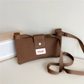 Detail of brown knitted crossbody bag with diamond texture and magnetic snap closure - Brown