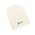 Detailed close-up of cream-white ribbed knit beanie with black 'me' script embroidery - White