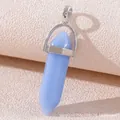 Light blue hexagonal stone pendant with a silver metal clasp in macro view - Luminous Blue Jade