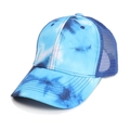 Close-up of blue tie-dye trucker hat showing breathable mesh and cotton texture - Blue
