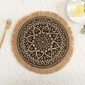 Close-up of a jute placemat with a black mandala pattern and fringed edges on a table - Natural Jute Tassel Black Pattern 3