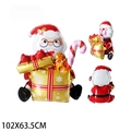 Vues de face et de côté d'un grand ballon Père Noël en aluminium de 102x63,5cm avec cadeau - Père Noël avec boîte cadeau jaune