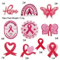 Close-up of 10-piece breast cancer awareness patches featuring pink ribbons and hearts - Ribbon Patch Combination