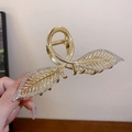 Pince à cheveux dorée en forme de feuille avec strass incrustés et design minimaliste - Feuille creuse dorée