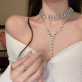 Silver layered necklace with square rhinestone pendant and tassel on female model - Silver Tassel Style