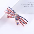 Close-up of sparkling pink and royal blue rhinestone bow hair clip with rose gold base - 2# Rhinestone Bow