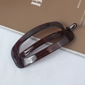 Rectangle tortoiseshell hair clip in dark brown resin with a sleek metallic spring - Coffee