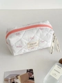White quilted cosmetic bag with pink bow prints and ribbon zipper pull details - Pink Sweet Bow Octagon Pouch