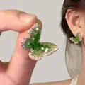 Macro shot of butterfly earrings with green gradient crystals and fine gold setting - 11# 925 Sterling Silver Earring Post - Green Gradient Butterfly