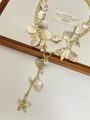 Layered gold necklace featuring natural pink gravel, shells, and starfish charms - Starfish Shell Necklace Z-1925