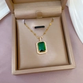 Gold emerald pendant necklace with square gemstone and pavé diamonds in a jewelry box - Emerald Green (E202)