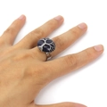 Macro detail of handmade silver wire wrapped Tree of Life ring with blue sandstone - Blue Sandstone
