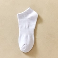 Single white cotton mid-calf sock with ribbed ankle design on a beige background - One Size / Ankle Sole Elastic White