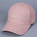 Detail of pink cotton baseball cap featuring 3D white CREATIVE embroidery and curved brim - M (56-58cm) / Pink
