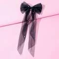 Detailed close-up of a large black tulle bow hair clip with elegant pearl accents - Mesh Pearl Bow / Black