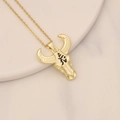 Detail view of gold bull skull pendant with zircon inlay and black etched texture - Black Etched Texture Bull Skull Style (16#)