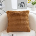 Brown faux fur plush square pillow placed on a soft white armchair in a cozy home setting - Bubble Plush-Brown-With Insert