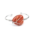 Macro detail of red jasper heart stone with silver wire tree of life on copper bracelet - Natural / Red Agate
