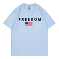 Light blue cotton T-shirt featuring FREEDOM text and American flag print in a flat lay view - Light Blue