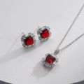 Detailed macro shot of silver necklace and earrings set with red square zircon stones - Silver Square Red (HQ0001(25))