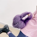 Detailed view of kids purple faux fur heart shell bag featuring long plush texture - Small / Purple