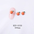 Macro shot of 8x8mm peach-shaped alloy nail charms with vibrant orange and green enamel finish - Orange Red Peach (White K Base) (8350)