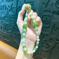 Elegante groene kristallen en parel kralen telefoonketting met strass balletjes. - Groen