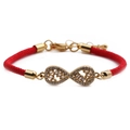 Detail of red braided infinity bracelet with gold-plated charm and sparkling zircons - Infinity / Red
