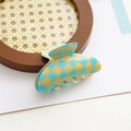 Detail shot of the blue and yellow checkered hair claw clip with glossy acetate finish - Grid Green Yellow