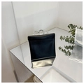 Minimalist black faux leather pouch with metallic snap closure on mirror surface - Small / Black