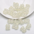 Macro shot of 20 pieces translucent pearlescent bear charms for DIY jewelry making - Frosted Crystal Yellow