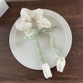 Cream scrunchie with light green satin bow and white petal accents on ceramic tray - Beige Tulip