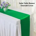 Emerald green satin table runner with a silky finish on a white tablecloth - 30x275cm / Verdant