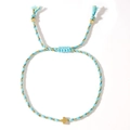 Handmade woven cross bracelet with light blue and gold cords and adjustable slide closure - Light Blue Gold Thread Cross