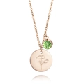 Close-up of rose gold birthday necklace with poppy flower pendant and green gemstone - August Poppy