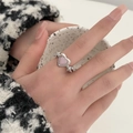 Silver-tone ring featuring a pink heart stone and hollow details on a finger - Vintage Hollow Pink Heart Ring (A-1336) / Pink