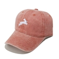 Close-up of coral pink washed cotton baseball cap featuring a white rabbit embroidery - M (56-58cm) / Orange